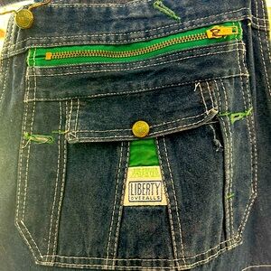 Vintage liberty Bib Overalls 34x30 wide leg denim with green trim on top part